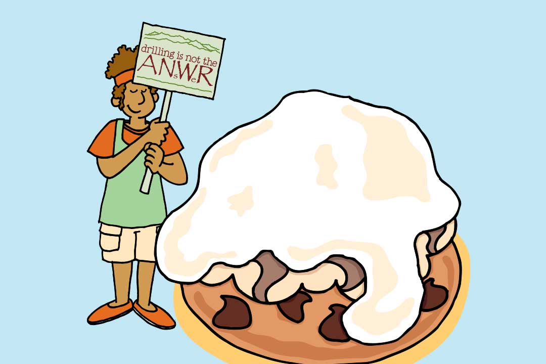 Kobieta pokazuje znak „Odwierty to nie rozwiązanie”, a obok kawałek loda Baked Alaska 